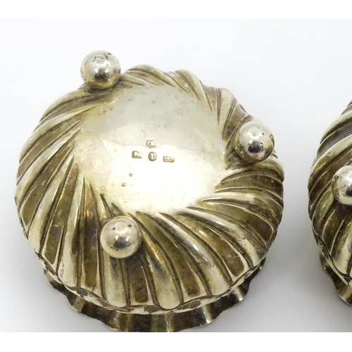 414 - A pair of Victorian silver salts with embossed floral decoration hallmarked Birmingham 1891, maker H... 