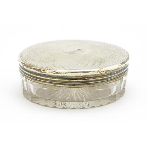 418 - A Victorian cut glass dressing table jar / pot with silver lid hallmarked London 1869, maker William... 