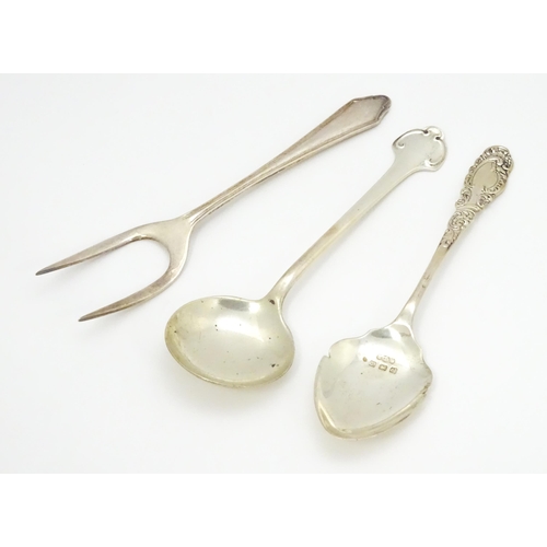 419 - Three assorted silver items to include a bread fork hallmarked Birmingham 1930, and two preserve spo... 