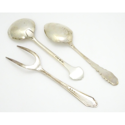 419 - Three assorted silver items to include a bread fork hallmarked Birmingham 1930, and two preserve spo... 