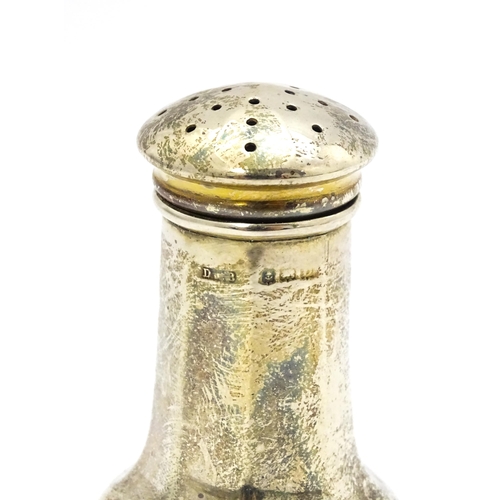 425 - A silver three piece cruet comprising pepper, salt and mustard with matching salt and mustard spoons... 