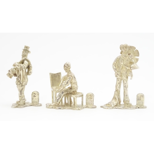 434 - Three silver menu / place card holders of figural form modelled as characters from Cries of London, ... 