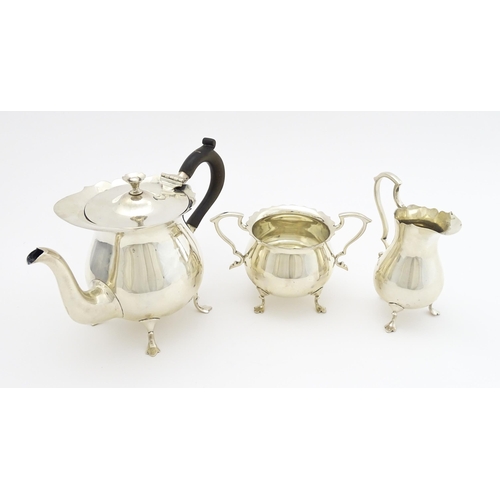 438 - A silver three piece tea set comprising teapot, sugar bowl and milk jug hallmarked London 1905, make... 