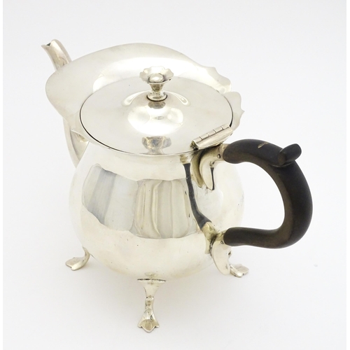 438 - A silver three piece tea set comprising teapot, sugar bowl and milk jug hallmarked London 1905, make... 