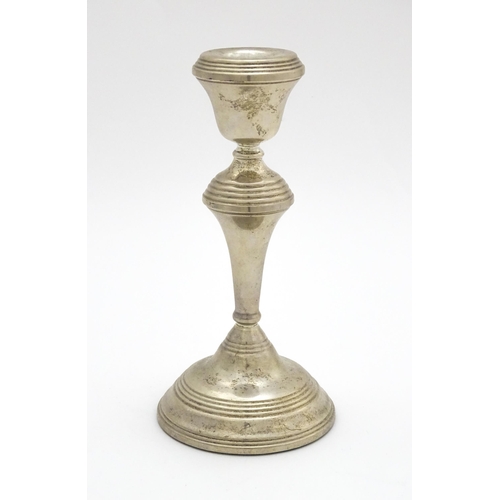 449 - A silver candlestick hallmarked Birmingham 1973, maker W. I. Broadway. Approx. 7 1/4