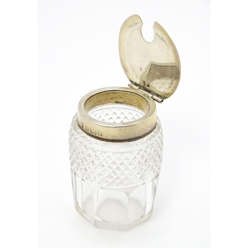 587 - A cut glass mustard pot with silver mounts hallmarked Birmingham 1904, maker Henry Matthews, with an... 