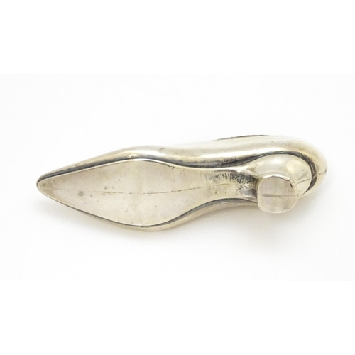 590 - A novelty silver pin cushion of shoe form, hallmarked Birmingham 1906, maker Levi & Salaman. Approx.... 