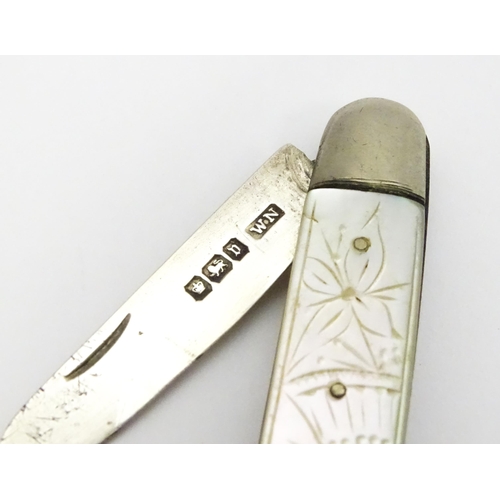 600 - A silver folding fruit knife with engraved mother of pearl handle, hallmarked Sheffield 1913, maker ... 