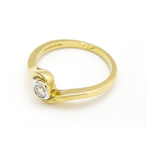 690 - A 9ct gold ring set with central diamond. Ring size approx. O 1/2