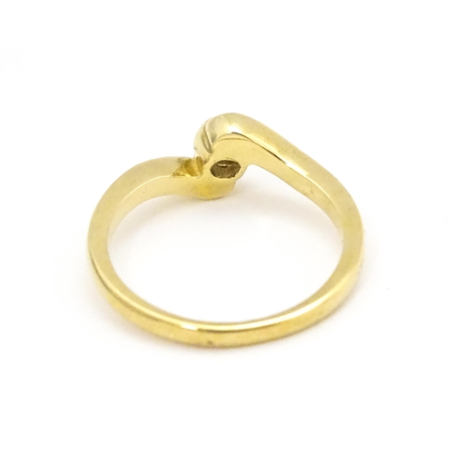 690 - A 9ct gold ring set with central diamond. Ring size approx. O 1/2