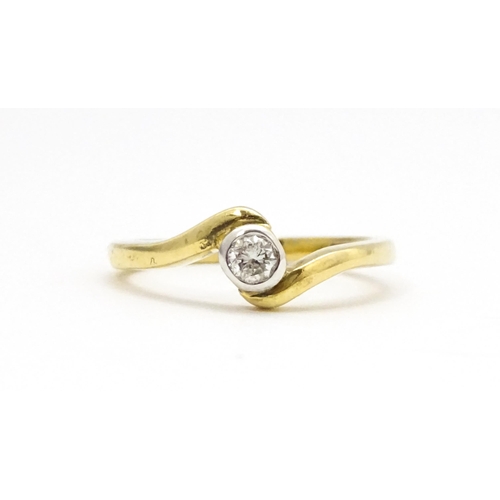 690 - A 9ct gold ring set with central diamond. Ring size approx. O 1/2