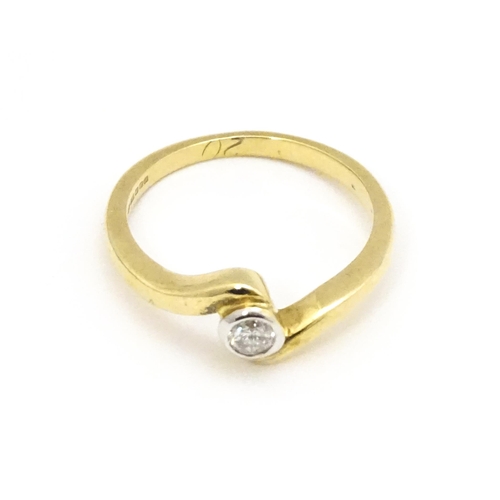 690 - A 9ct gold ring set with central diamond. Ring size approx. O 1/2