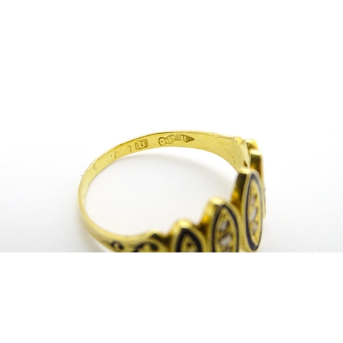 694 - Mourning / Memorial Jewellery: A Victorian gold ring set with diamonds and black enamel detail. Ring... 