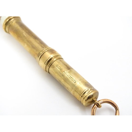 951 - A 9ct gold pencil holder hallmarked Birmingham 1917, maker E. Baker. Approx. 2 1/4