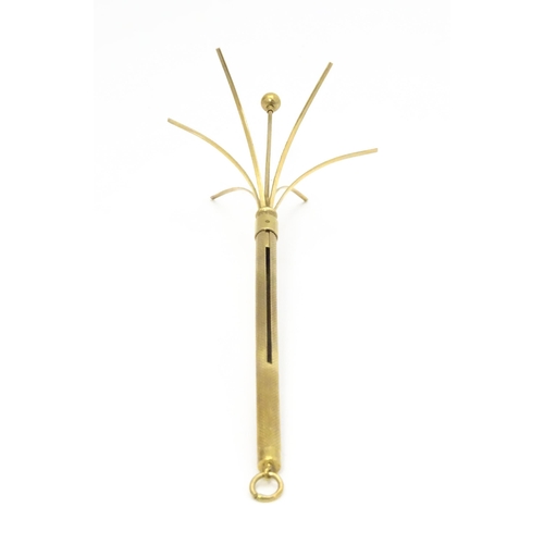 952 - A 9ct gold swizzle stick / cocktail stirrer hallmarked Birmingham 1982, maker William Manton. Approx... 