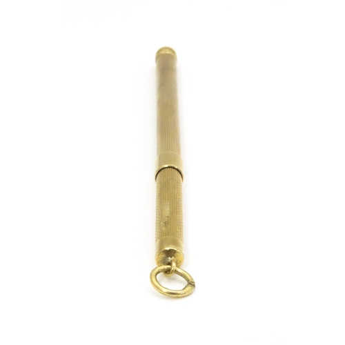 952 - A 9ct gold swizzle stick / cocktail stirrer hallmarked Birmingham 1982, maker William Manton. Approx... 