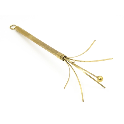 952 - A 9ct gold swizzle stick / cocktail stirrer hallmarked Birmingham 1982, maker William Manton. Approx... 