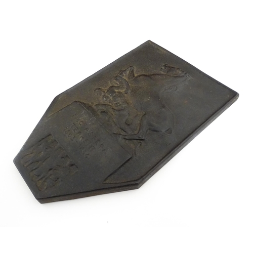 1105 - A 20thC cast plaque commemorating the King's German Legion with relief decoration depicting a rearin... 