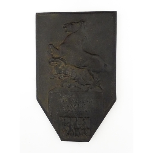 1105 - A 20thC cast plaque commemorating the King's German Legion with relief decoration depicting a rearin... 