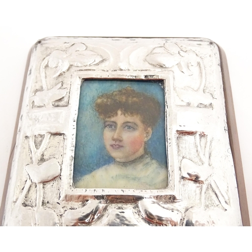 1163 - A late 19thC watercolour portrait miniature on celluloid with an Art Nouveau white metal surround an... 