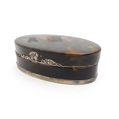 1169 - A 19thC tortoiseshell snuff box of oval form with silver plate mounts. Approx. 3 1/2