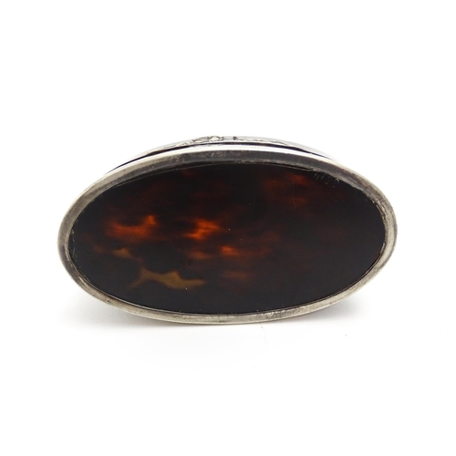 1169 - A 19thC tortoiseshell snuff box of oval form with silver plate mounts. Approx. 3 1/2