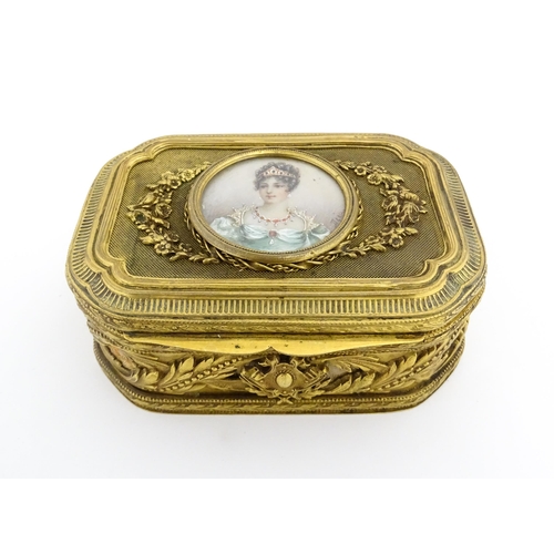 1207 - A Continental gilt metal jewellery box with banded foliate decoration, the lid with inset portrait m... 