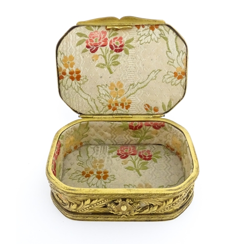 1207 - A Continental gilt metal jewellery box with banded foliate decoration, the lid with inset portrait m... 