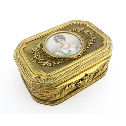 1207 - A Continental gilt metal jewellery box with banded foliate decoration, the lid with inset portrait m... 