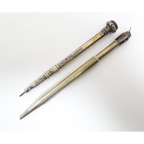 1218 - Two silver propelling pencils one with engraved acanthus scroll decoration and seal top marked .925 ... 