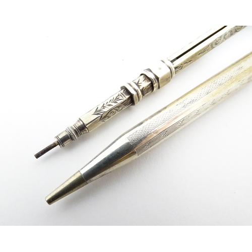 1218 - Two silver propelling pencils one with engraved acanthus scroll decoration and seal top marked .925 ... 