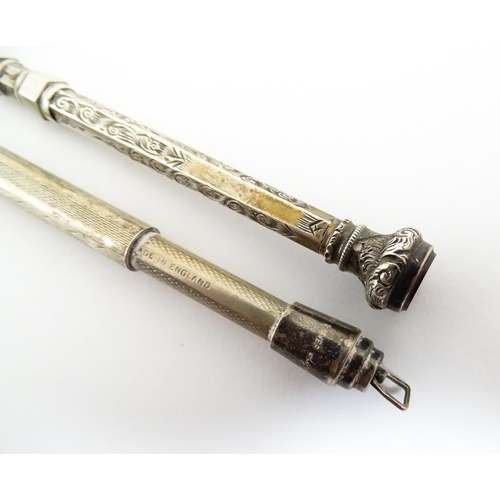 1218 - Two silver propelling pencils one with engraved acanthus scroll decoration and seal top marked .925 ... 