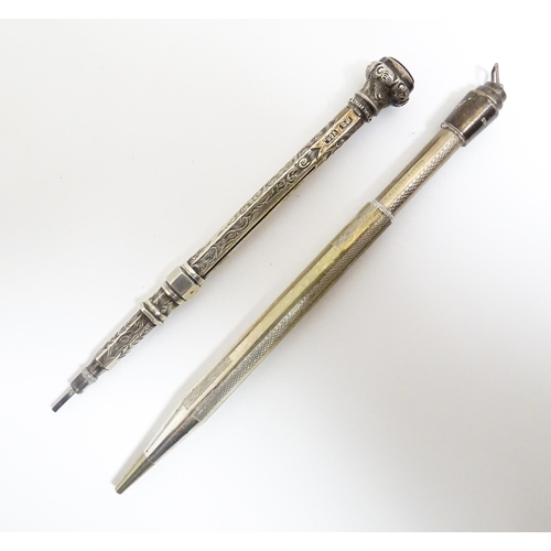 1218 - Two silver propelling pencils one with engraved acanthus scroll decoration and seal top marked .925 ... 