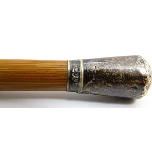 1248 - An Army Officer's swagger stick with silver top, hallmarked London 1907. Approx 28