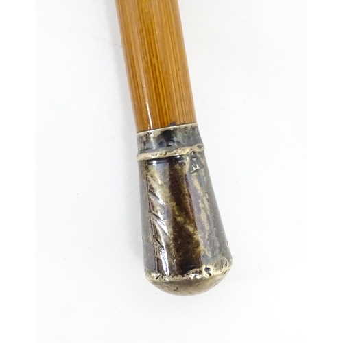 1248 - An Army Officer's swagger stick with silver top, hallmarked London 1907. Approx 28