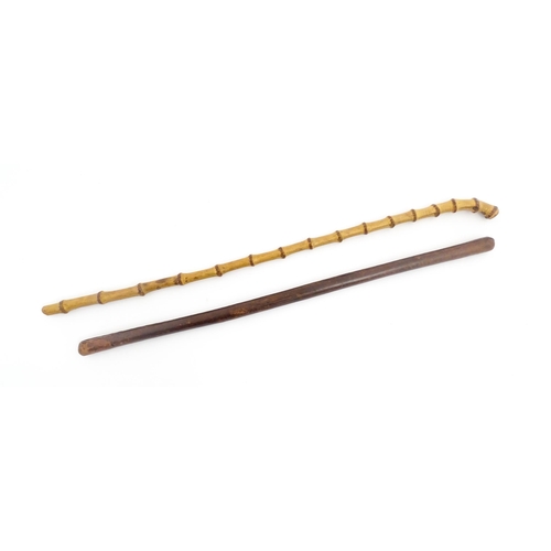 1250 - Two early to mid 20thC Officer's swagger sticks, comprising a leather covered and bamboo examples, t... 