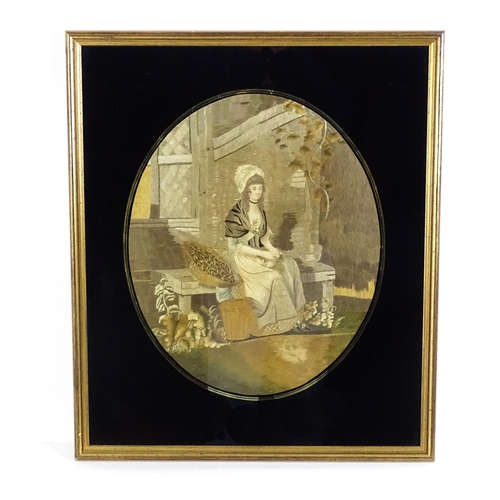 1257 - An early 19thC silkwork embroidery depicting a seated young lady husking seeds. Within a verre eglom... 