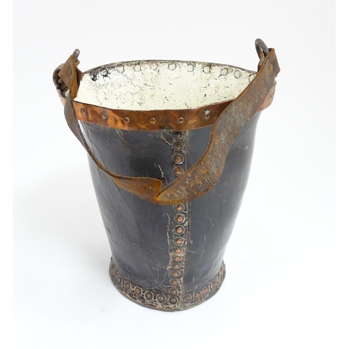 1272 - A 19thC leather fire bucket with Royal insignia / coat of arms with copper banding. Approx. 11 1/2