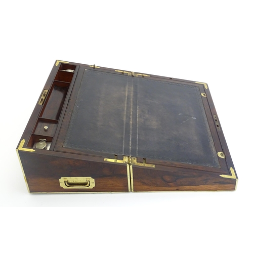 1284 - A 19thC brass bound rosewood writing box / slope with twin campaign style handles, single drawer und... 