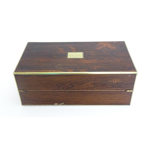 1284 - A 19thC brass bound rosewood writing box / slope with twin campaign style handles, single drawer und... 