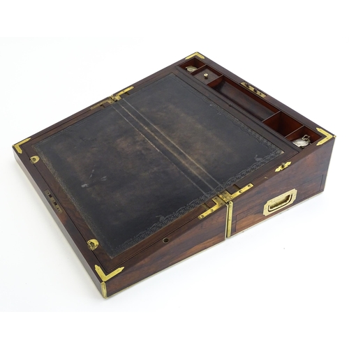 1284 - A 19thC brass bound rosewood writing box / slope with twin campaign style handles, single drawer und... 