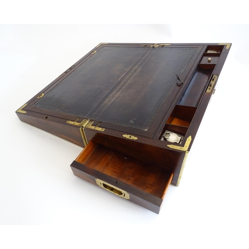 1284 - A 19thC brass bound rosewood writing box / slope with twin campaign style handles, single drawer und... 