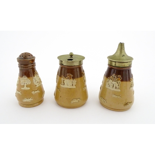 125 - A Royal Doulton two tone stoneware three piece cruet set comprising salt, pepper and mustard, decora... 