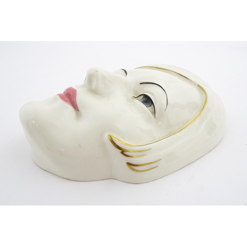 126 - A Royal Doulton wall mask modelled as Greta Garbo, model no. HN1594. Marked under. Approx. 7 3/4