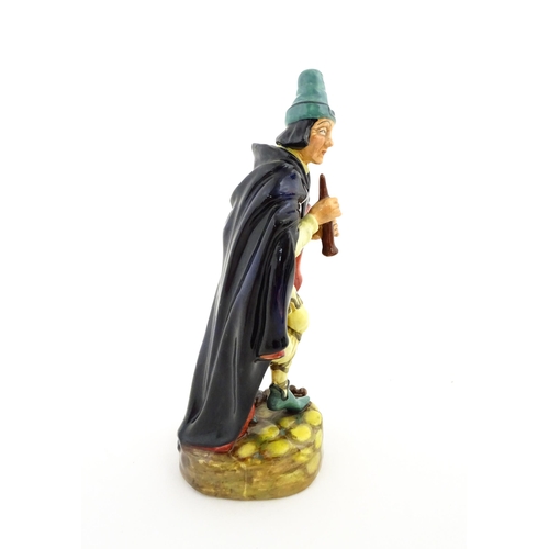 127 - A Royal Doulton figure The Pied Piper, model no. HN 2102. Marked under. Approx. 9