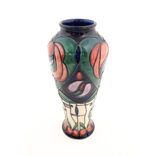 137 - A Moorcroft vase decorated in the Tribute to Charles Rennie Mackintosh pattern designed by Rachel Bi... 