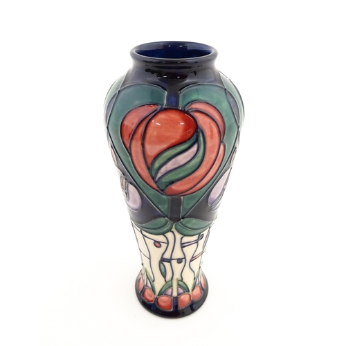 137 - A Moorcroft vase decorated in the Tribute to Charles Rennie Mackintosh pattern designed by Rachel Bi... 