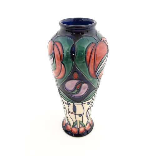 137 - A Moorcroft vase decorated in the Tribute to Charles Rennie Mackintosh pattern designed by Rachel Bi... 