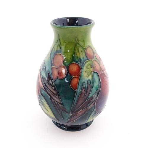 142 - A Moorcroft vase of squat form decorated in the Finches pattern, designed by Sally Tuffin. Marked un... 