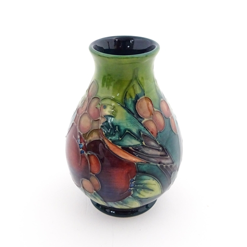 142 - A Moorcroft vase of squat form decorated in the Finches pattern, designed by Sally Tuffin. Marked un... 